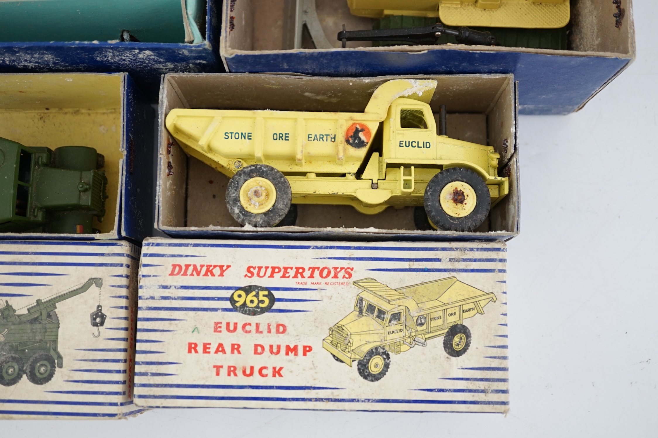 Thirteen Dinky Toys and Supertoys, etc. including; an MGB (113), a Riley Pathfinder, a Triumph Herald, an Armoured Command Vehicle (677), a 20-ton Mounted Crane (972), a Recovery Tractor (661)